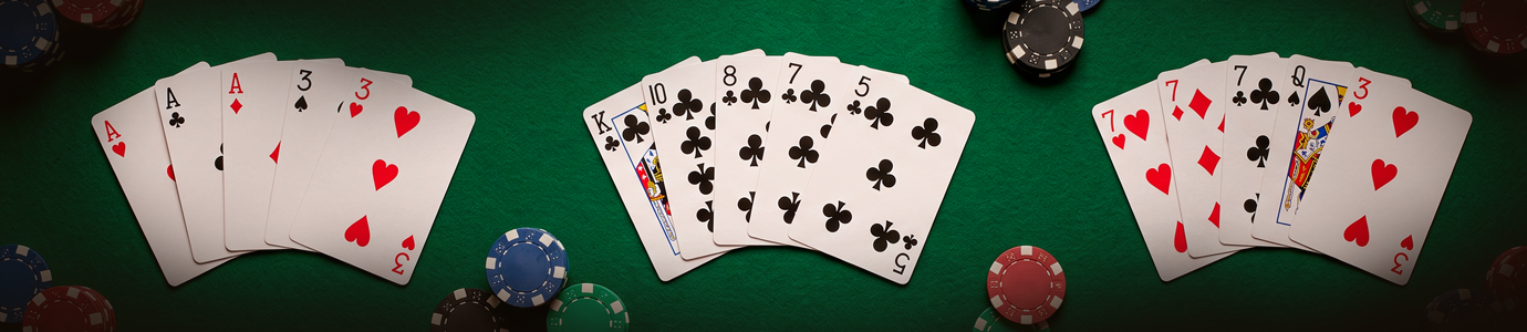Poker hand ranking examples showing pairs, a club straight, and three of a kind on a casino table