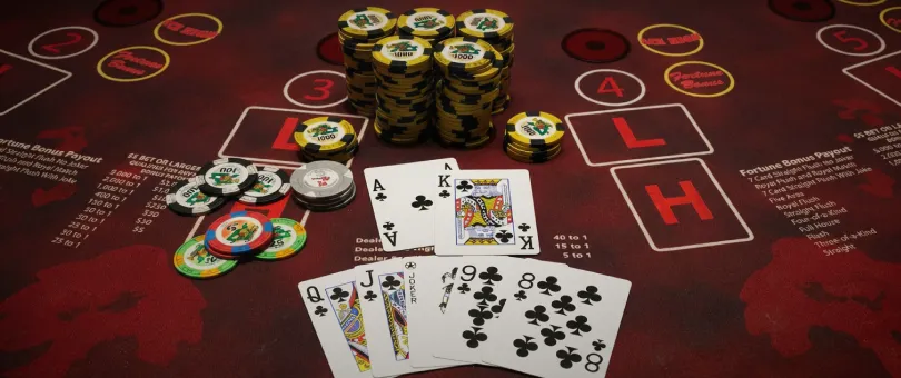 Pai Gow Poker table with cards, chips, and high and low hand areas